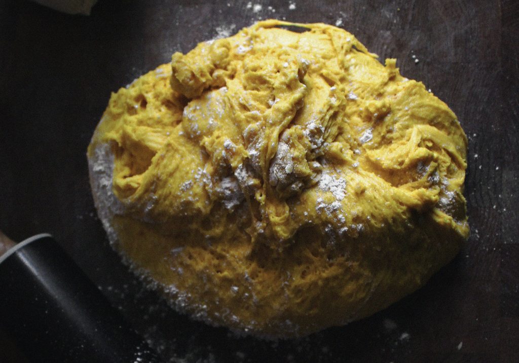A photograph of a round of dough ready to make Saffron buns, a traditional Cornish recipe that is perfect for picnics. 