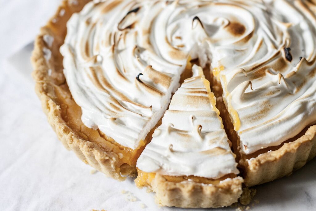 A photograph of homemade pumpkin meringue pie. It looks like a delicious recipe. 